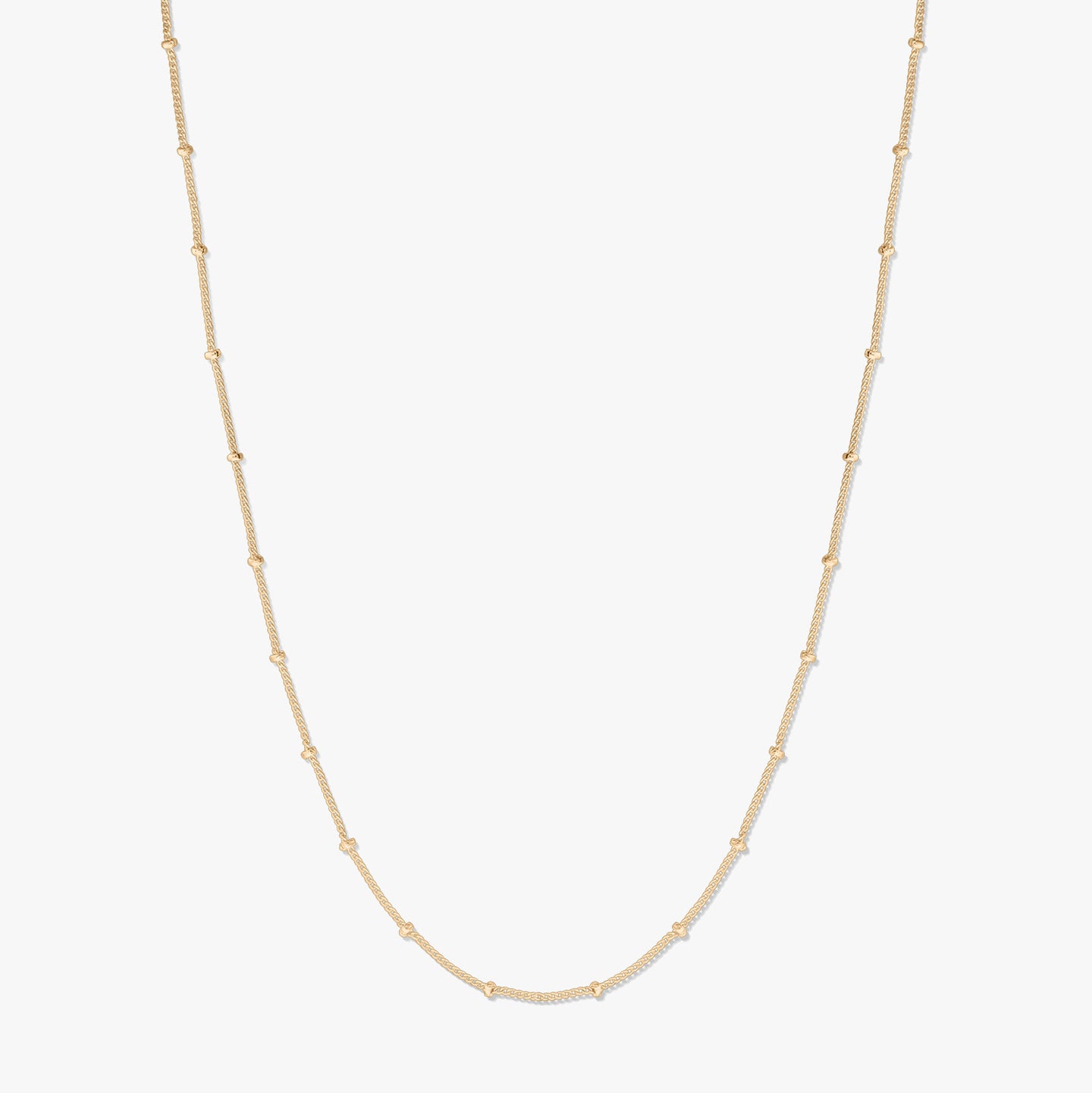 Gold-plated silver beaded chain necklace displayed on a white background, forming a gentle U shape with small bead stations along the chain.