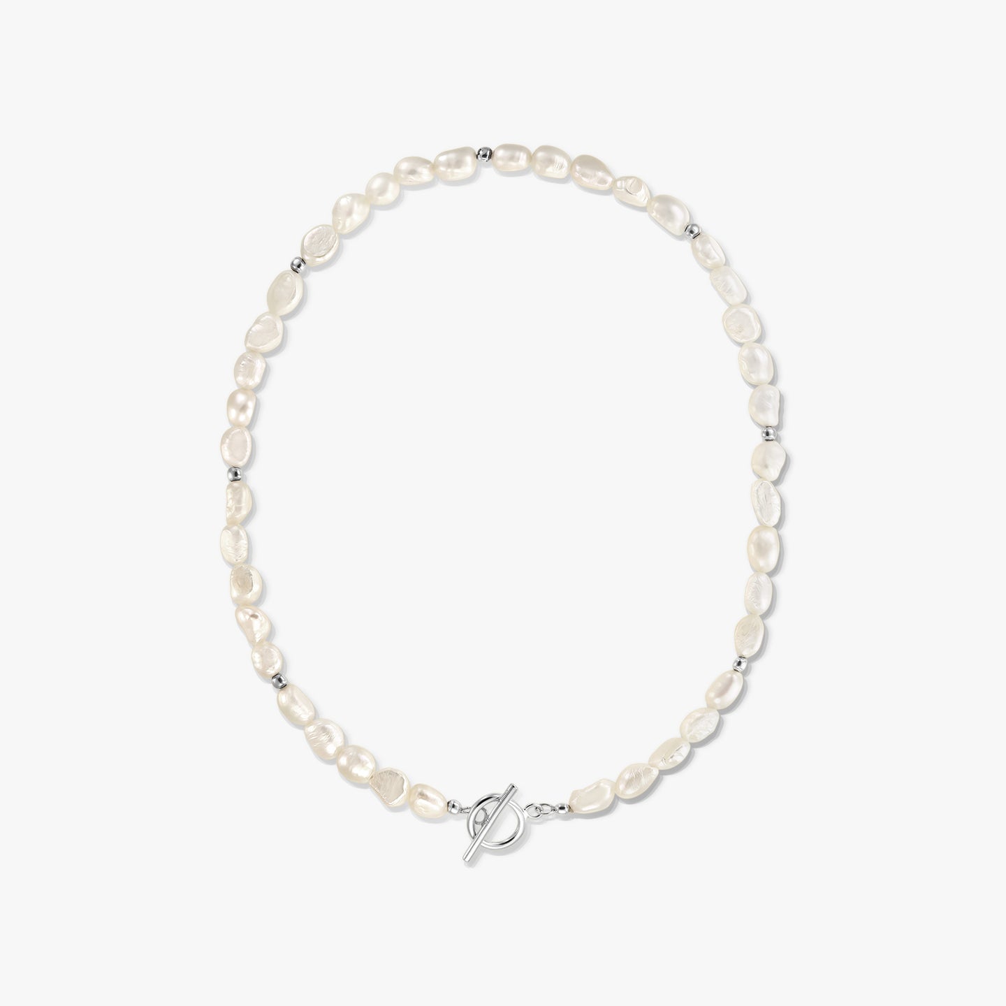 Centered studio photo of a silver toggle‑clasp necklace with natural white baroque pearls on a solid white background.