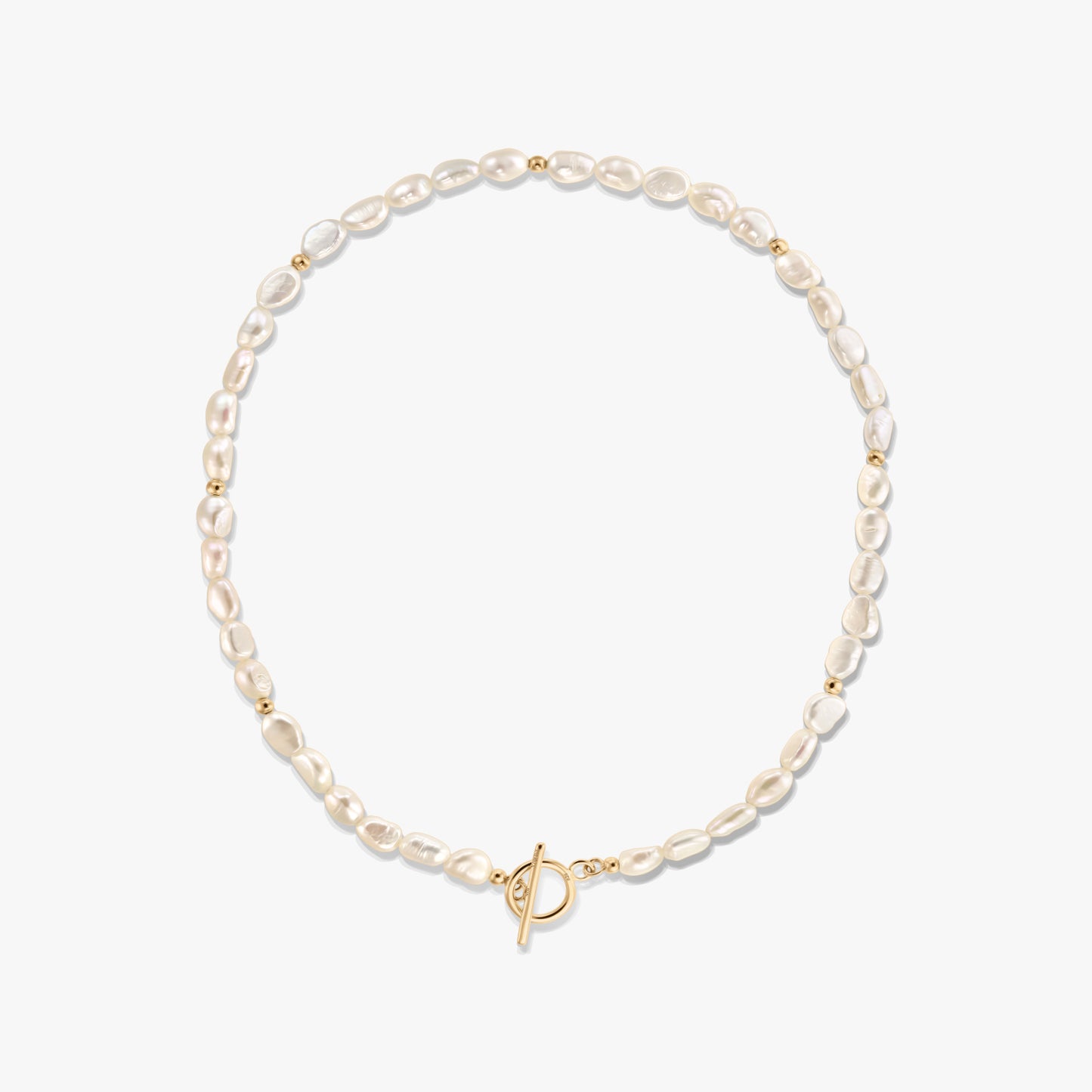 Square product image of a dainty natural freshwater pearl necklace with small gold bead accents and a front toggle clasp, photographed on a white background.