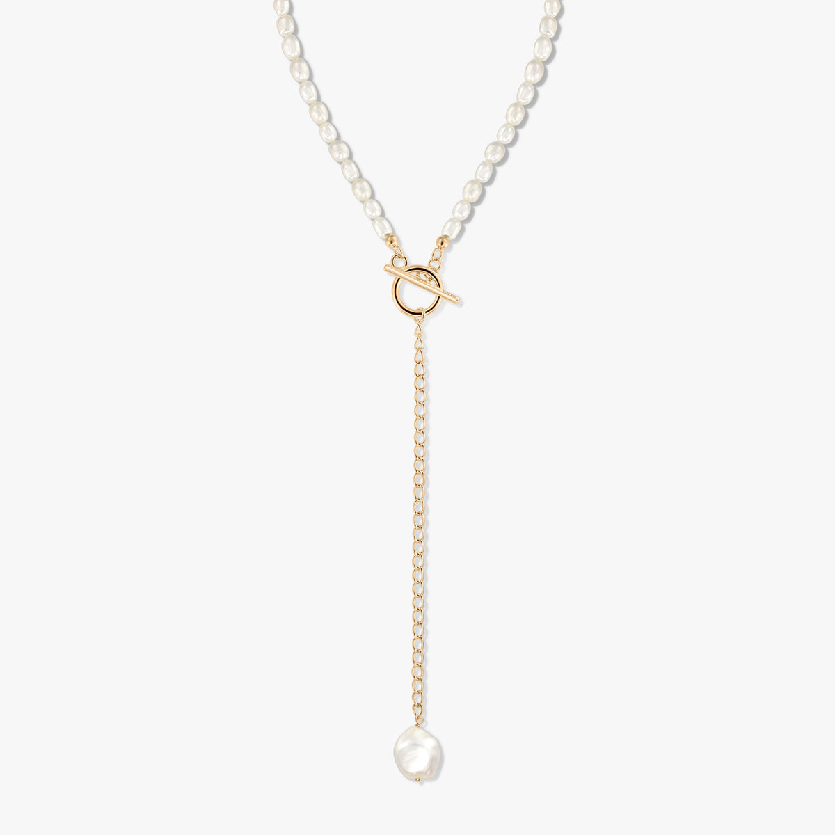 Gold-plated silver Y-necklace with a strand of cultured pearls, front toggle clasp, and a dangling chain ending in a baroque pearl on a white background.