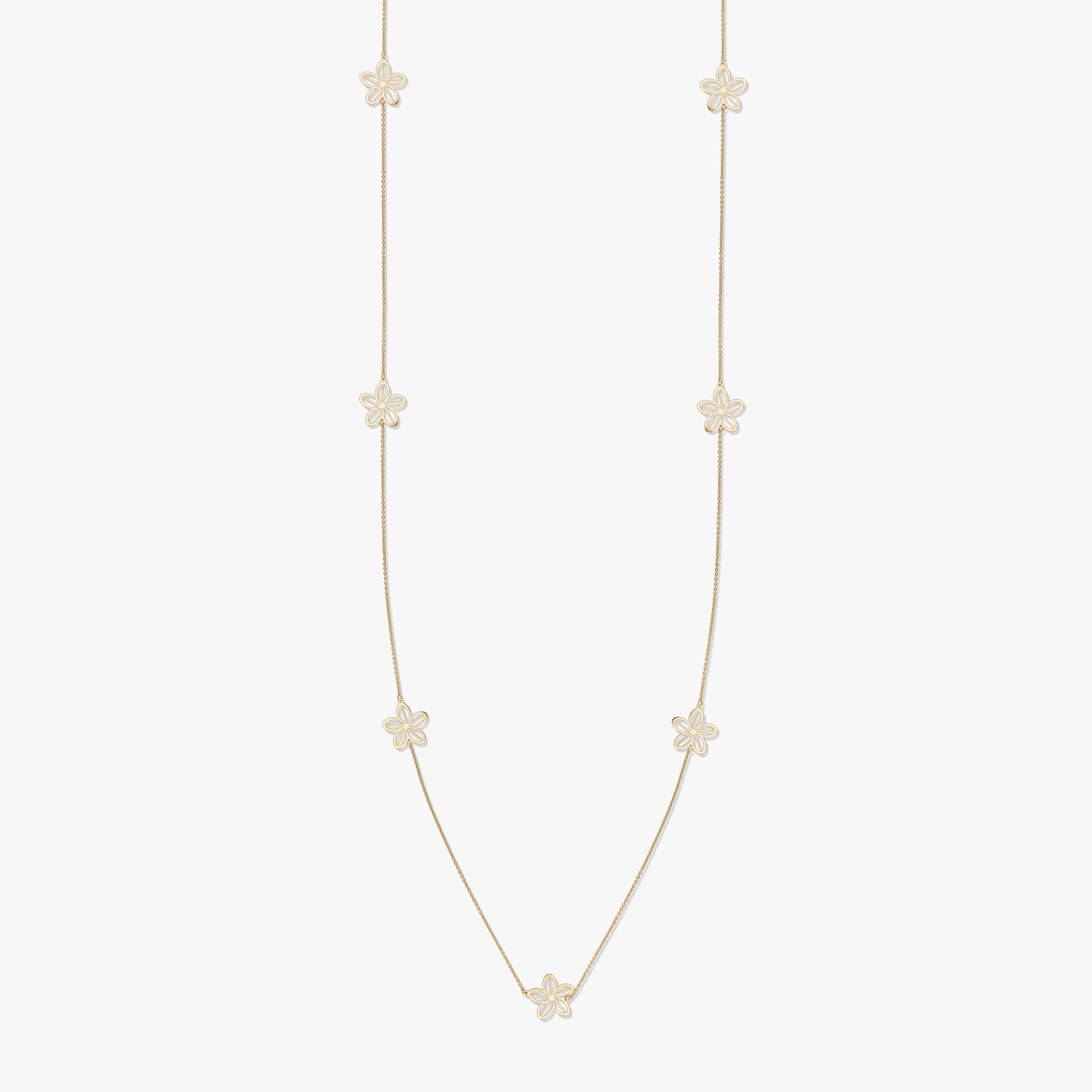 Gold necklace with floral motifs on a white background