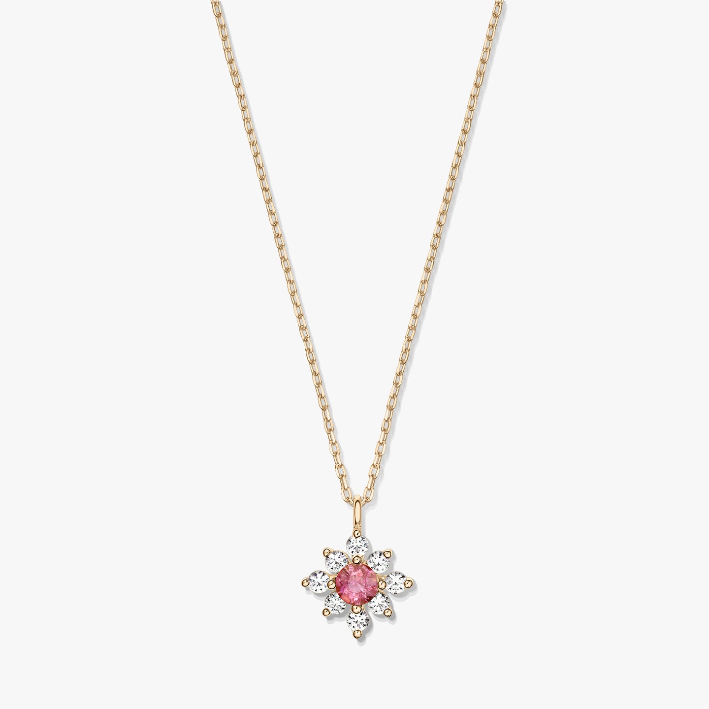 14K gold necklace with a floral pendant featuring a pink tourmaline center surrounded by white sapphires on a white background.
