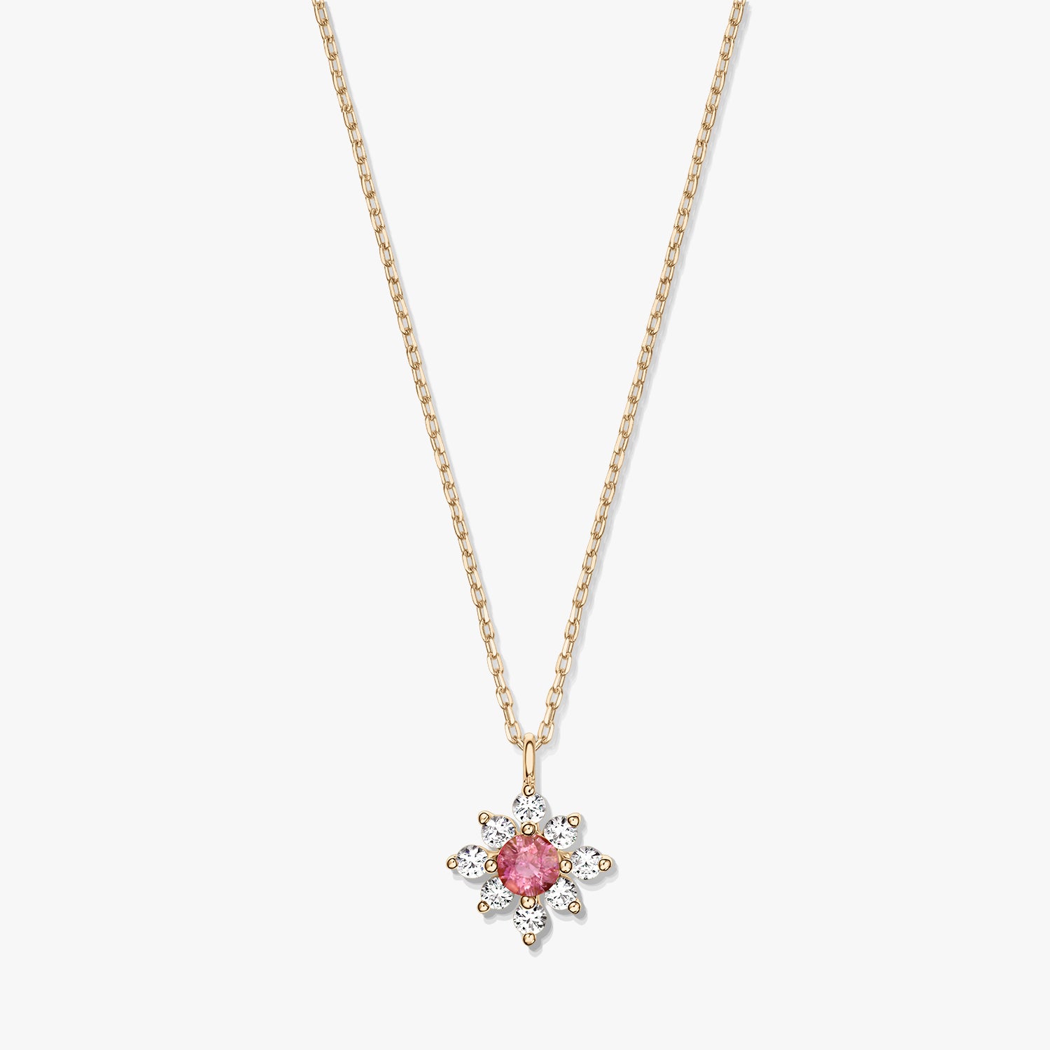 14K gold necklace with a floral pendant featuring a pink tourmaline center surrounded by white sapphires on a white background.