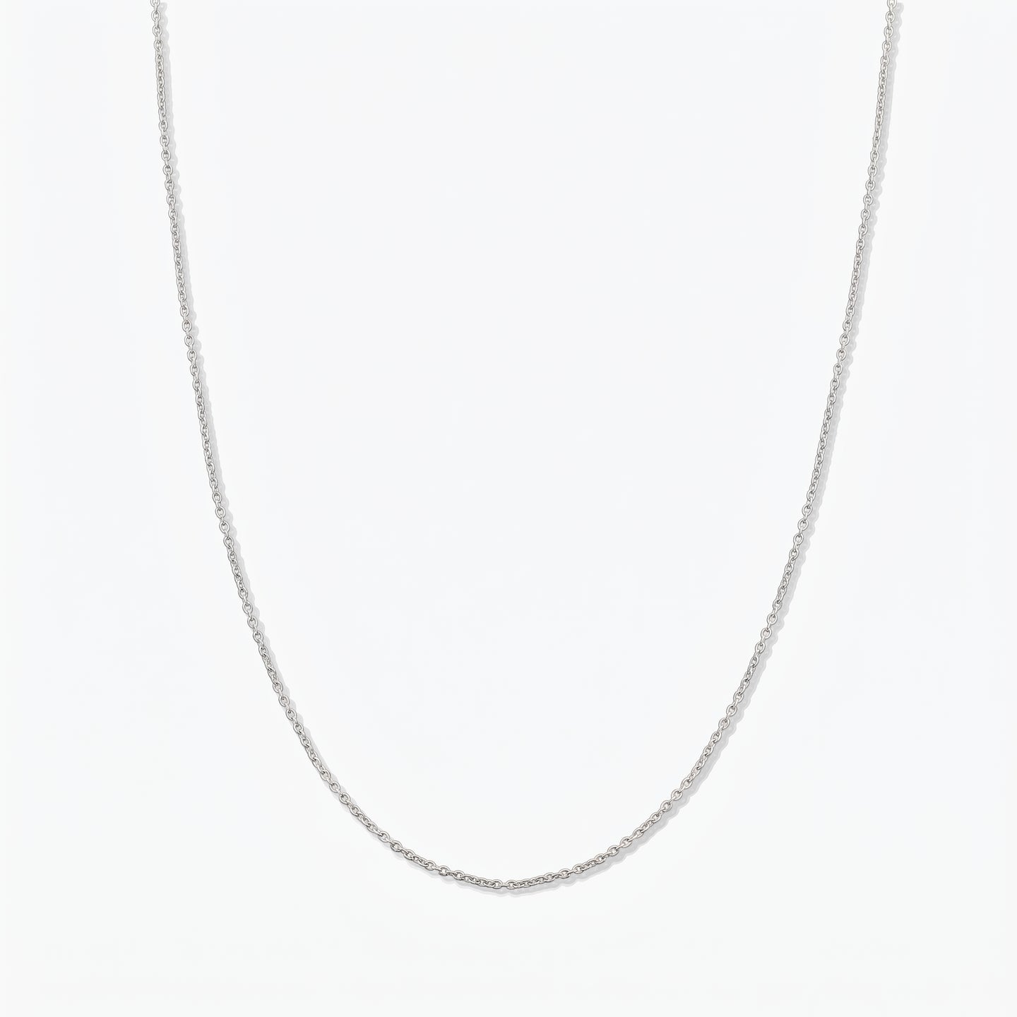 Simple sterling silver chain necklace photographed on a white background.