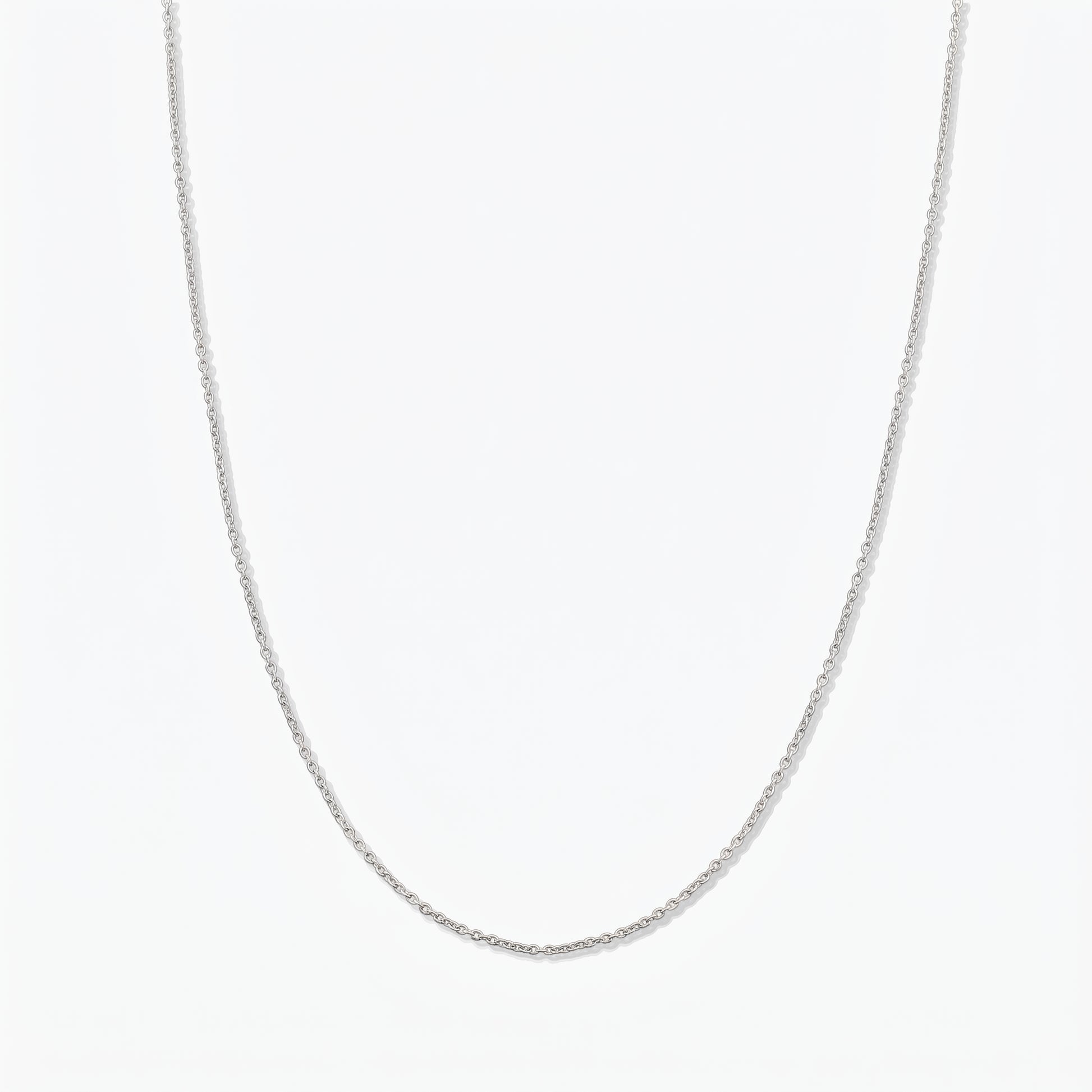 Simple sterling silver chain necklace photographed on a white background.