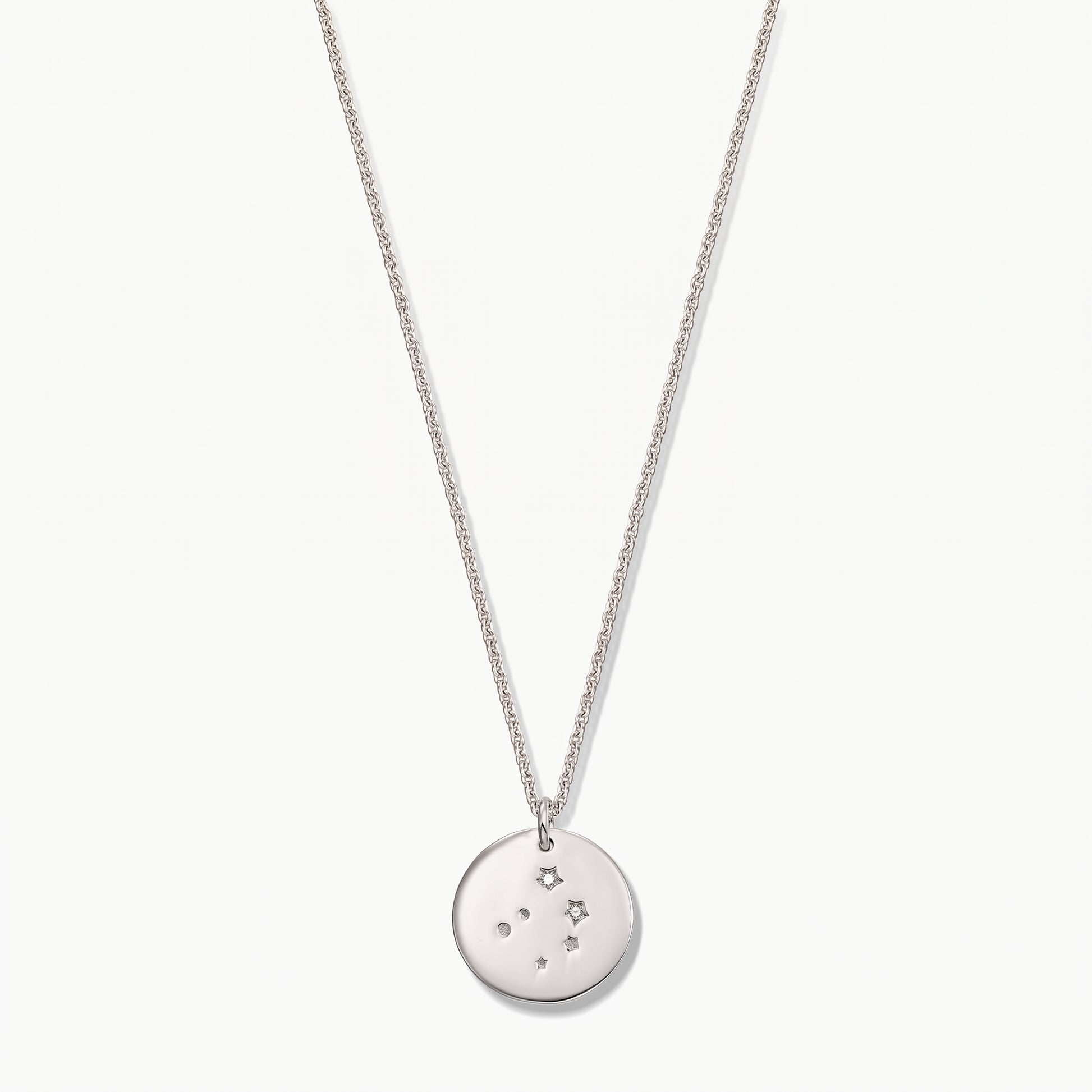Sterling silver Libra zodiac coin necklace with white sapphire accents on a delicate chain, photographed on a white background.