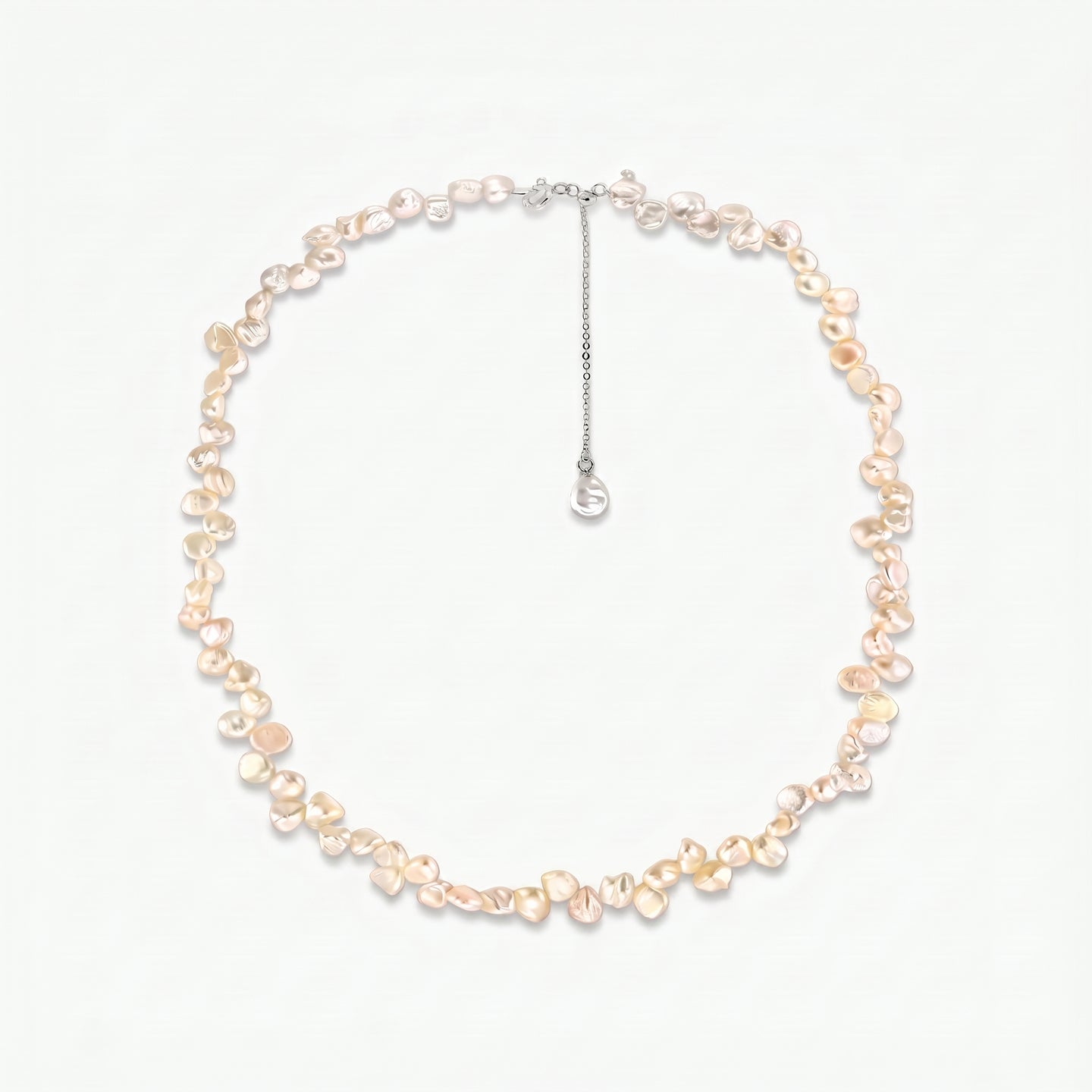 Brielle sterling silver necklace with pink keshi freshwater pearls and an adjustable extender chain on a white background.