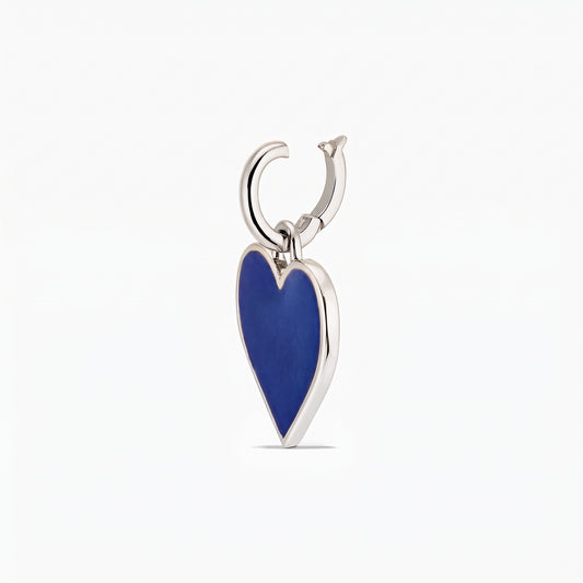 Close-up of a silver heart-shaped pendant with a deep blue inlay on a white background.