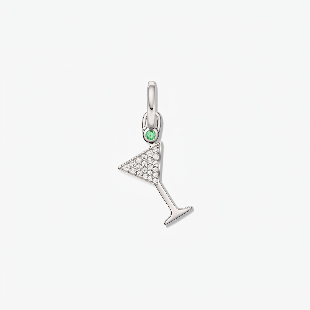 Sterling silver cocktail glass pendant with pavé white zirconia and a small green accent stone, isolated on a white background.