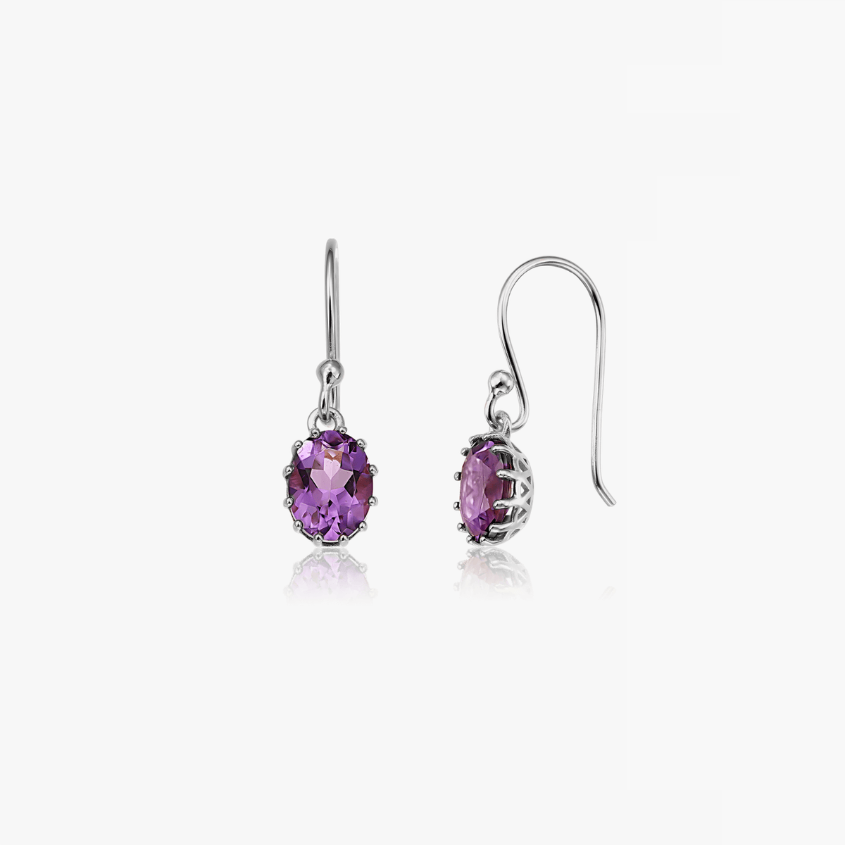 Pair of silver earrings with faceted purple amethyst stones on a white background.