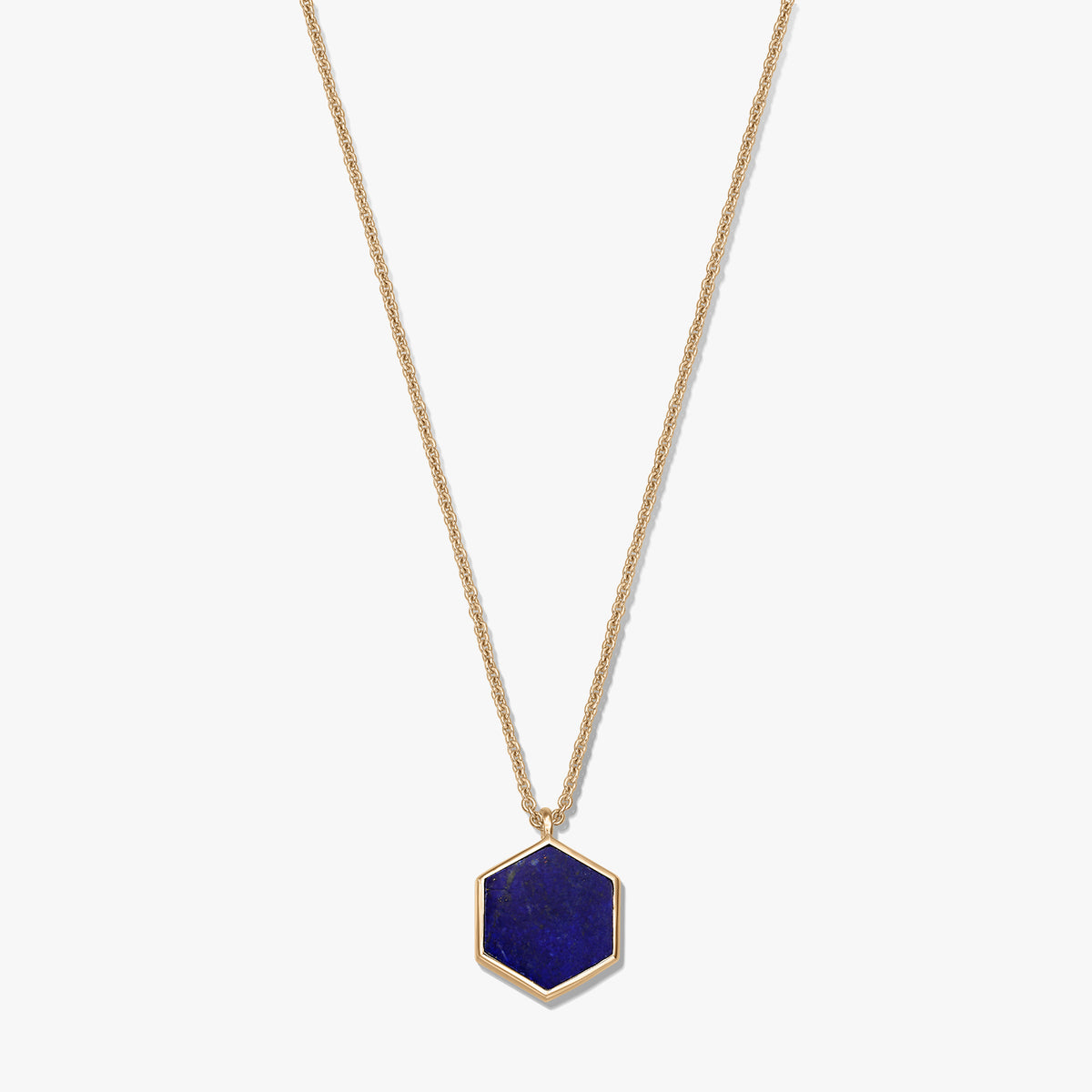 Gold-plated sterling silver necklace with a hexagon lapis lazuli pendant on a white background.