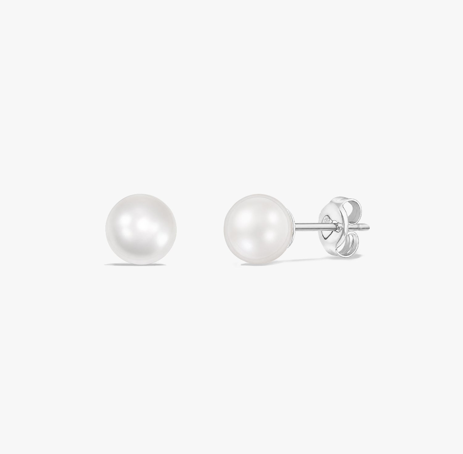 Pair of classic pearl stud earrings with natural white pearls set in 925 sterling silver on a white background.