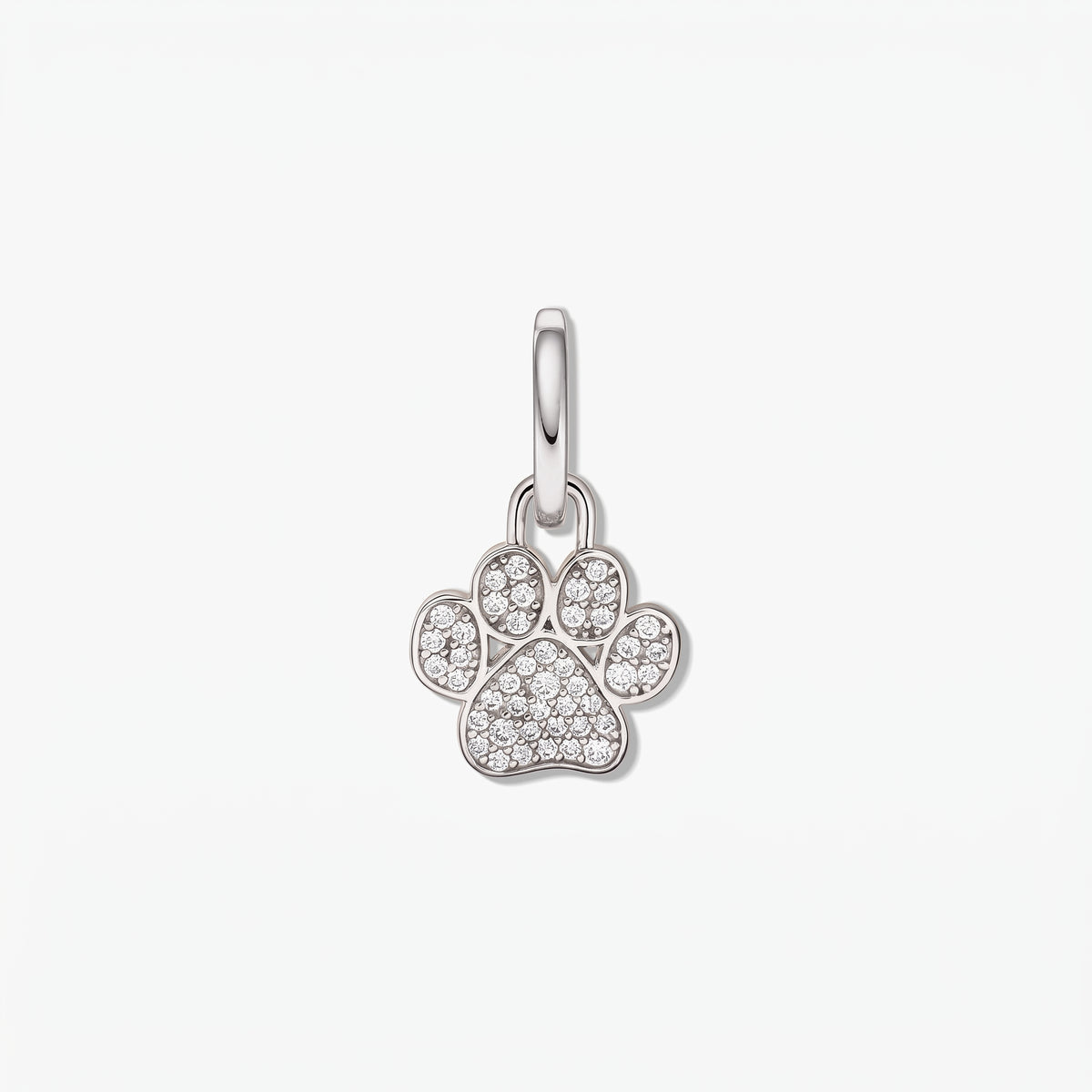 Sterling silver paw-print pendant set with white cubic zirconia on a polished bail, isolated on a white background.