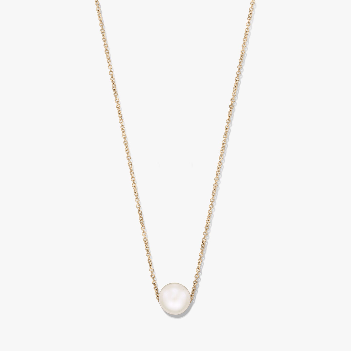 Delicate chain necklace with a single natural white pearl centered on a gold‑tone chain, isolated on a white background.