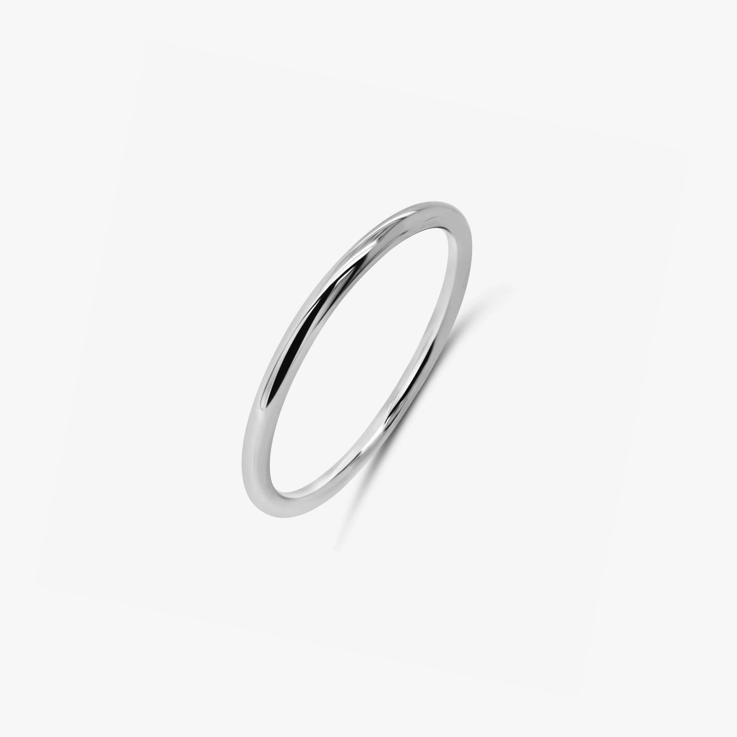 A minimalist silver ring photographed on a white background.