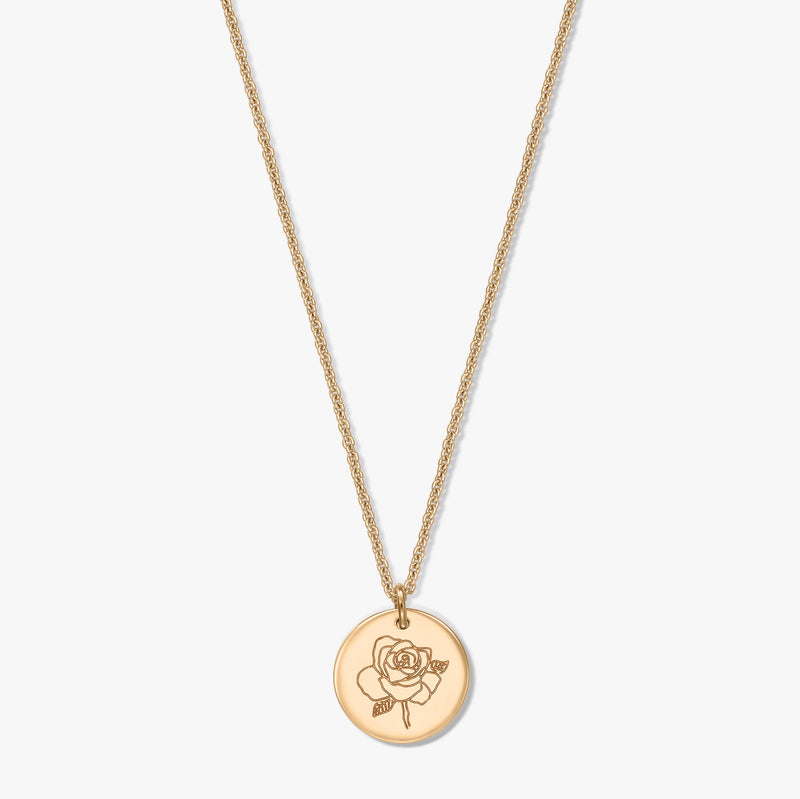 Gold‑plated silver necklace with a round medallion engraved with a rose, photographed centered on a white background.
