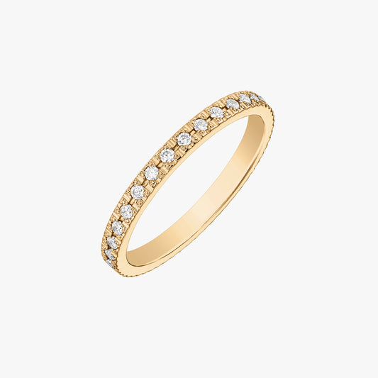 Square studio image of a slim 14K yellow gold wedding band set with white zirconia stones, isolated on a white background at a slight angle.