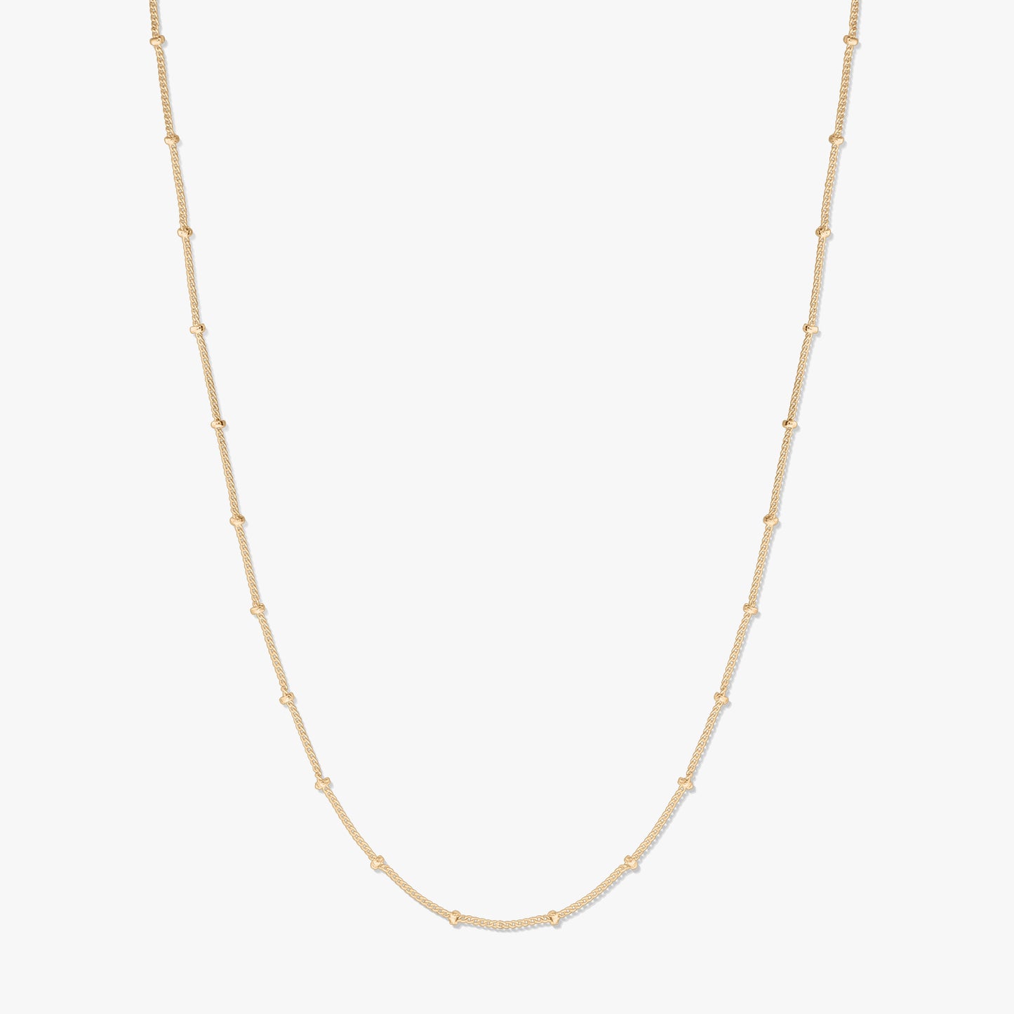 Gold-plated silver beaded chain necklace displayed on a white background, forming a gentle U shape with small bead stations along the chain.
