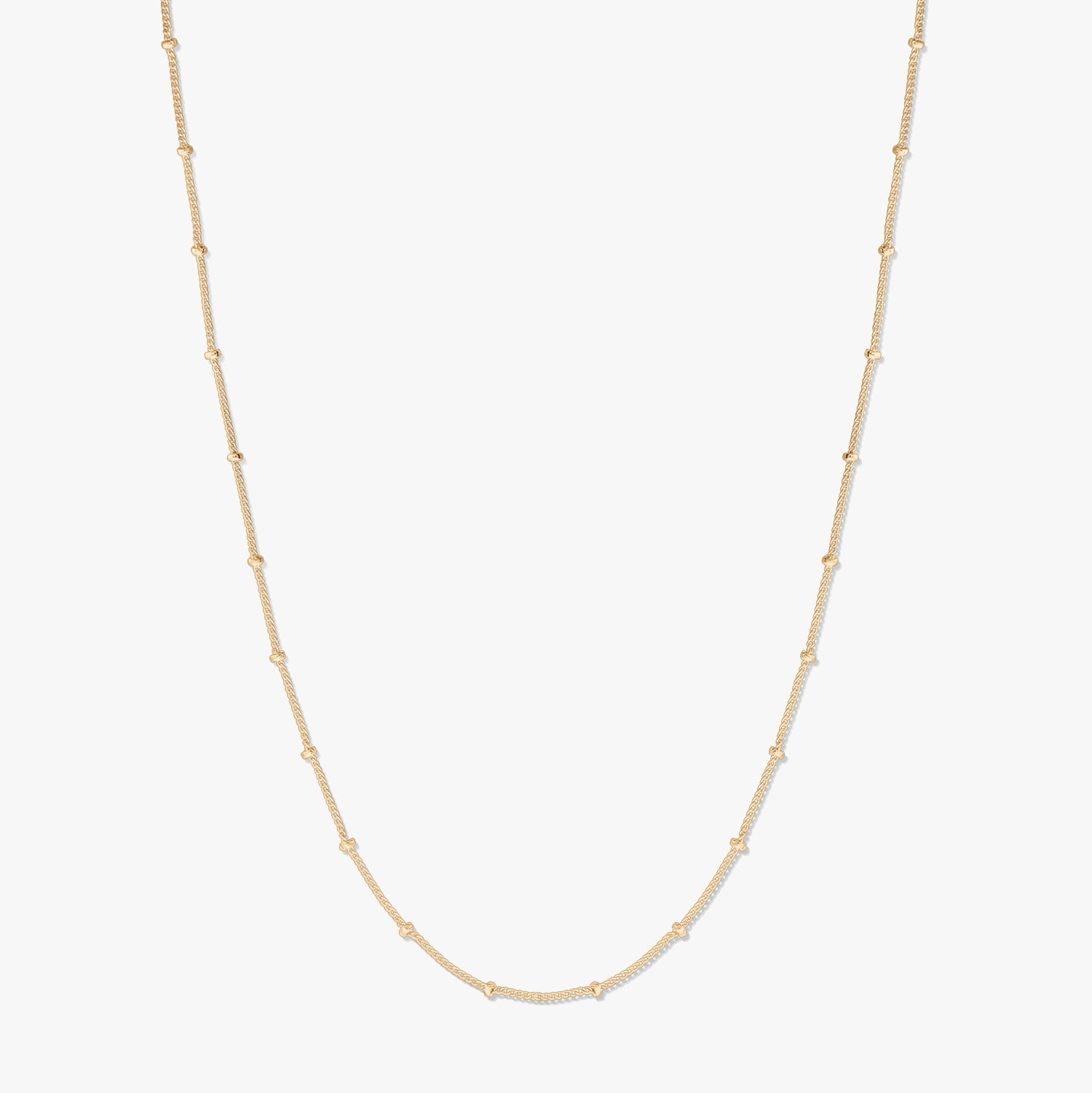 Gold-plated silver beaded chain necklace displayed on a white background, forming a gentle U shape with small bead stations along the chain.