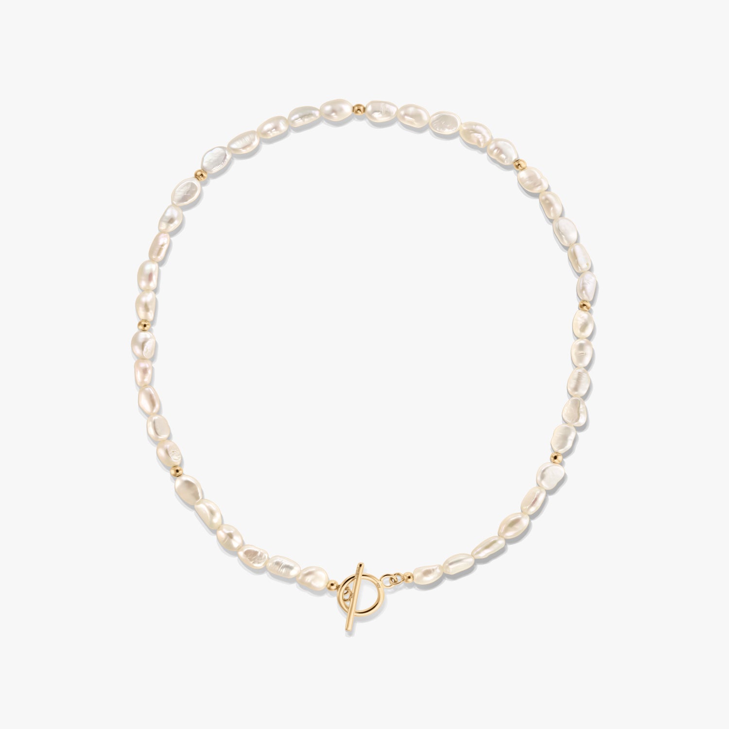 Square product image of a dainty natural freshwater pearl necklace with small gold bead accents and a front toggle clasp, photographed on a white background.
