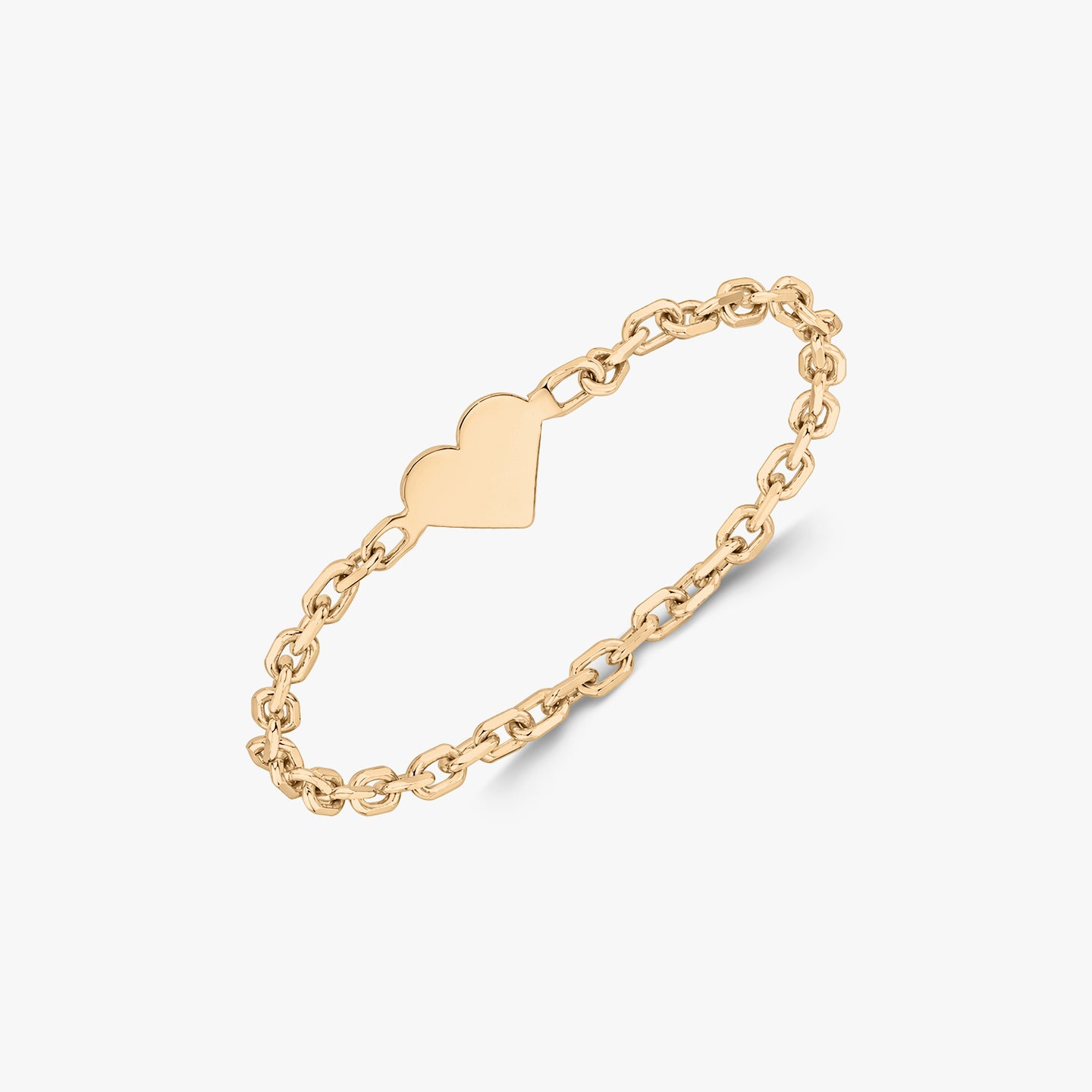 A gold chain ring with a heart-shaped centerpiece on a white background.
