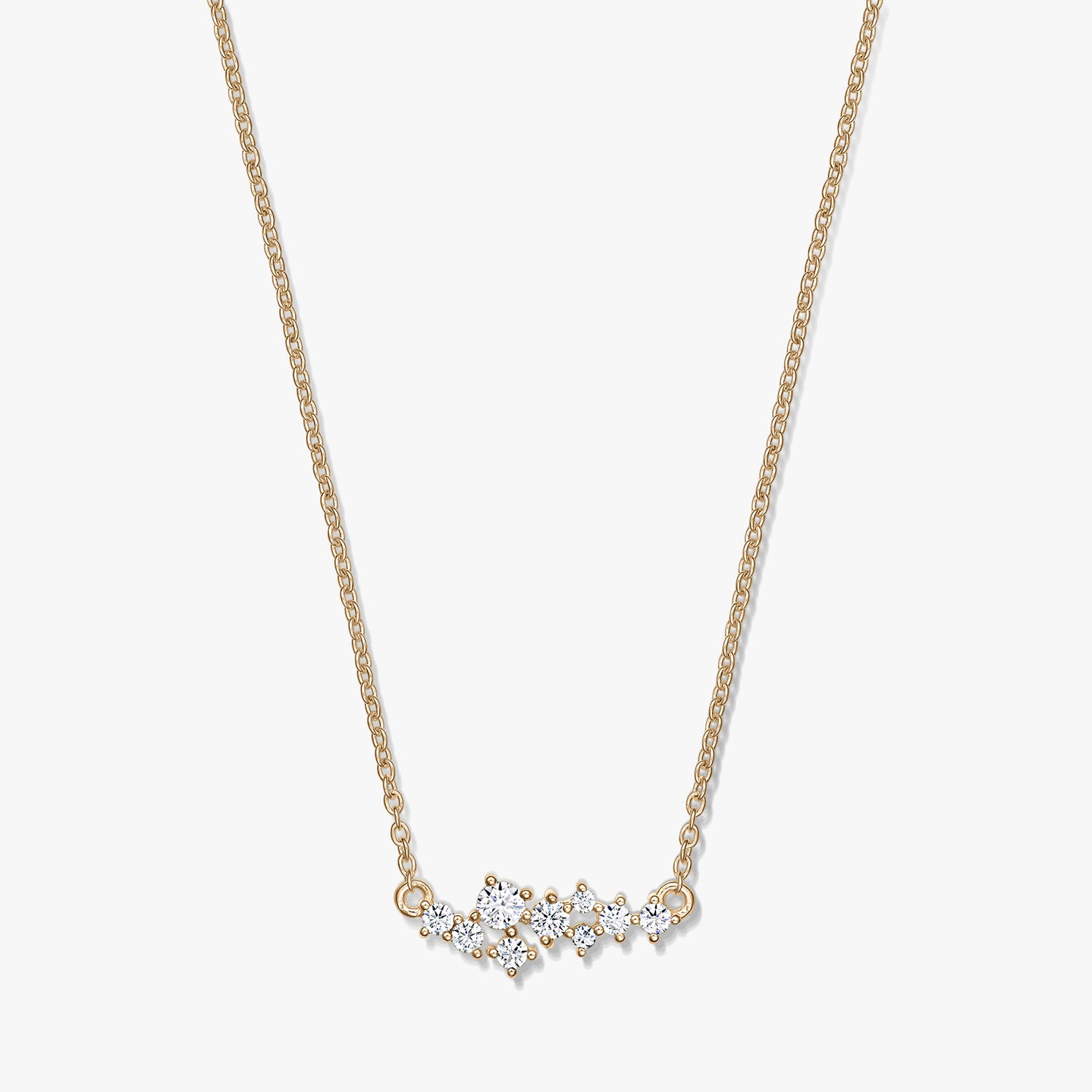Golden Constellation silver necklace with a delicate chain and a starry cluster of clear stones, photographed on a white background.