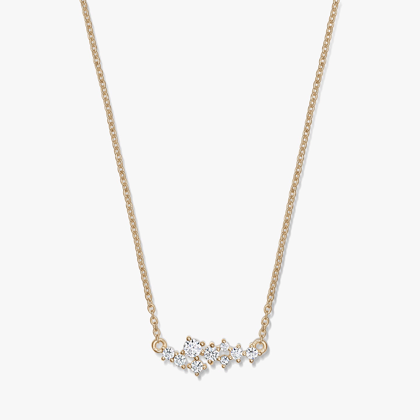 Golden Constellation silver necklace with a delicate chain and a starry cluster of clear stones, photographed on a white background.