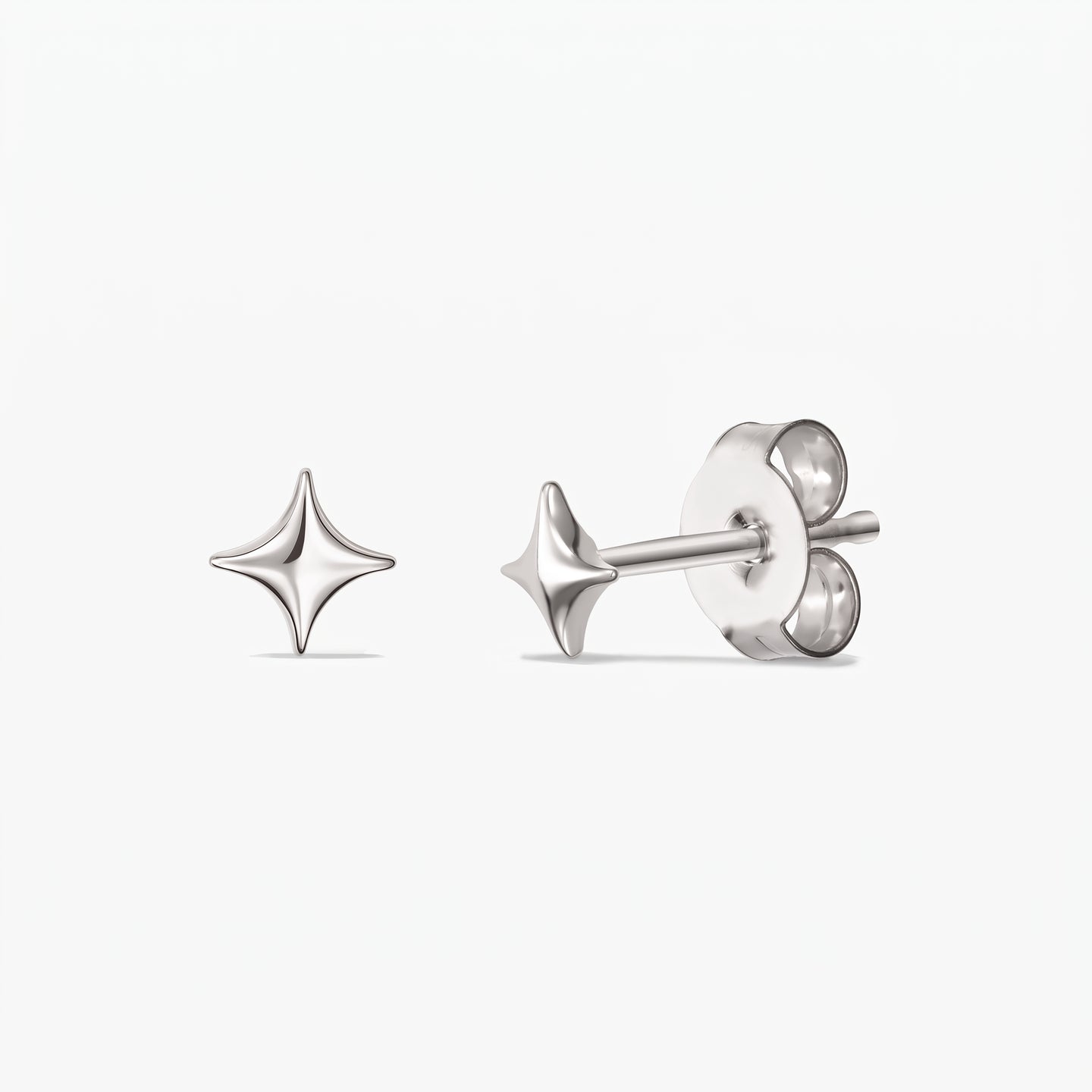 Cosmic Star Silver Earrings — a pair of 925 sterling silver star-shaped stud earrings shown front and side with butterfly backs on a white background.
