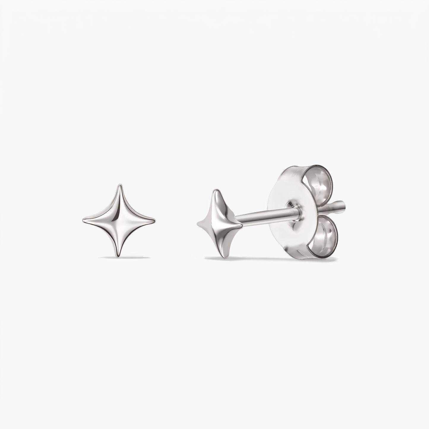 Cosmic Star Silver Earrings — a pair of 925 sterling silver star-shaped stud earrings shown front and side with butterfly backs on a white background.