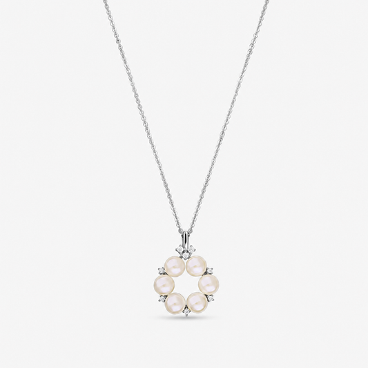 Sterling silver necklace with a circular pendant of six natural pearls accented by small white zirconia, shown on a fine chain against a white background.