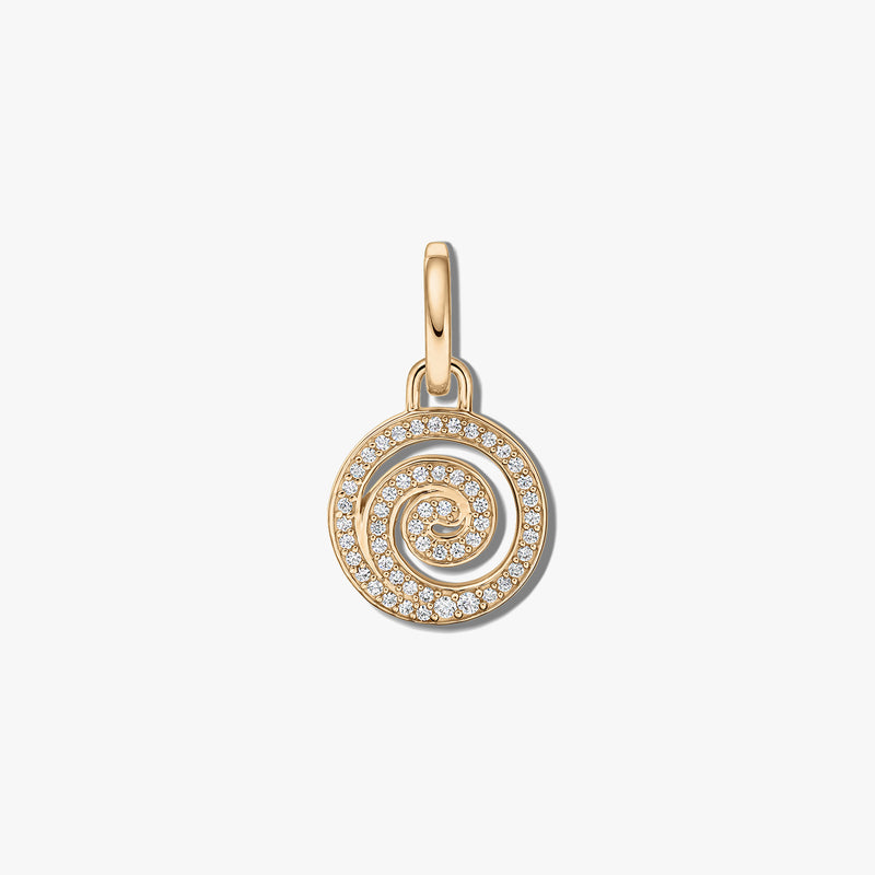 Close-up of a spiral silver pendant set with clear zirconia stones on a white background.