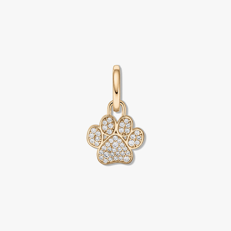 Gold-plated sterling silver paw print pendant with clear zirconia pavé on a white background.