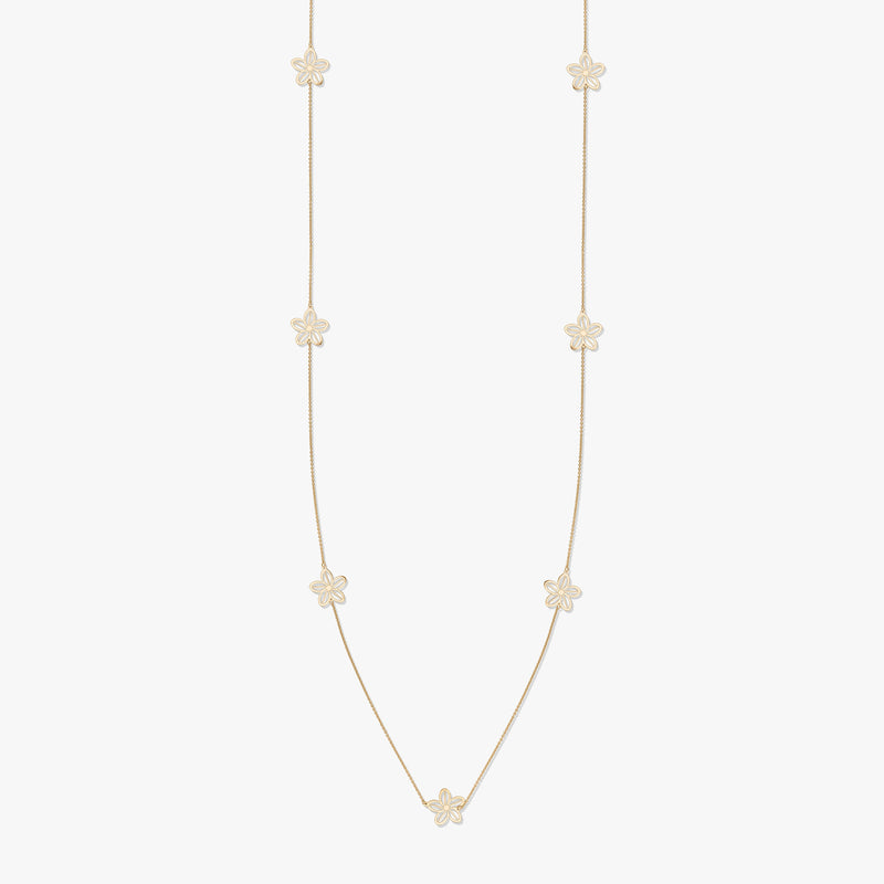 Gold necklace with floral motifs on a white background
