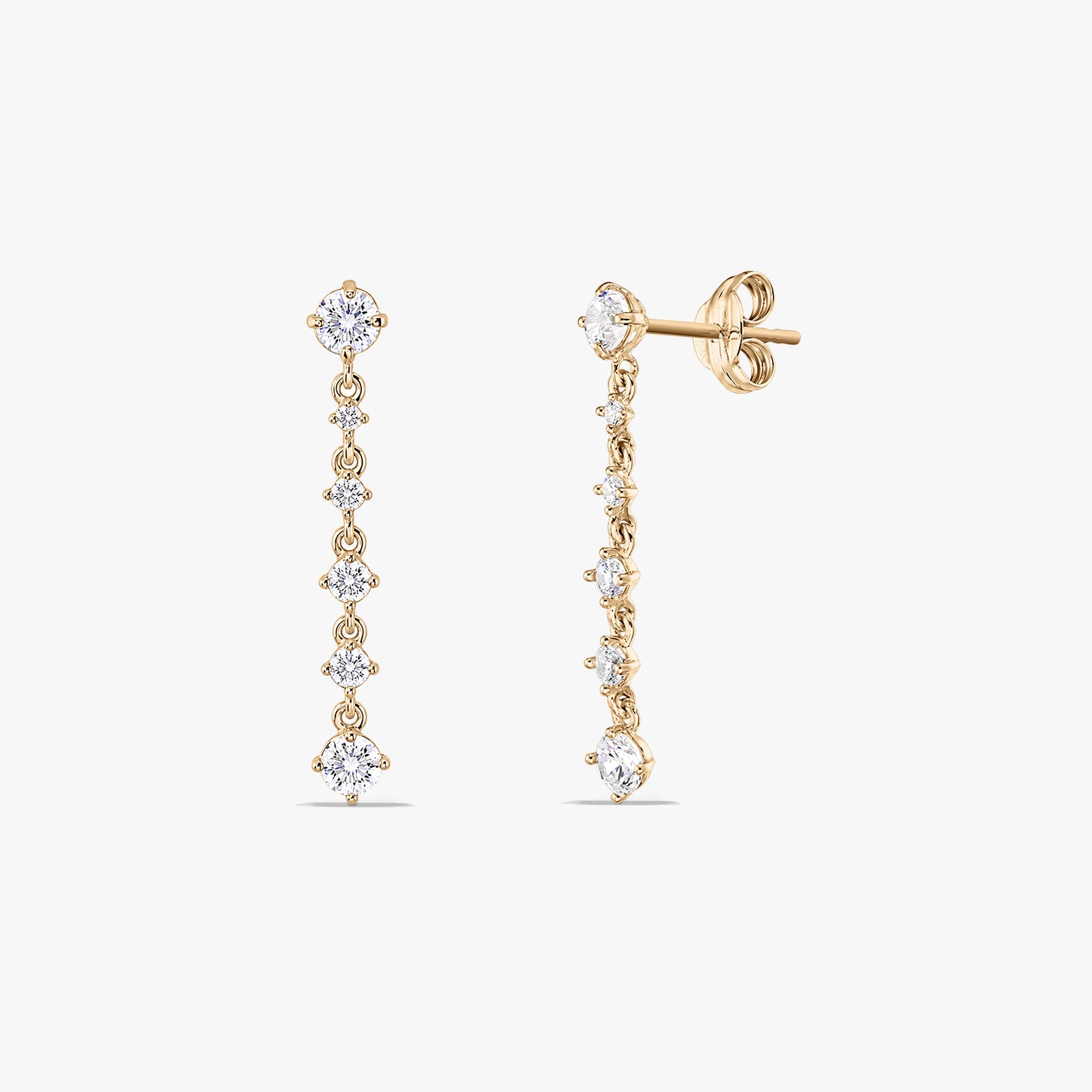 Pair of 14K yellow gold drop earrings with a vertical line of round white cubic zirconia; one earring shown front-on and the other angled to show the stud post and butterfly back on a white background.