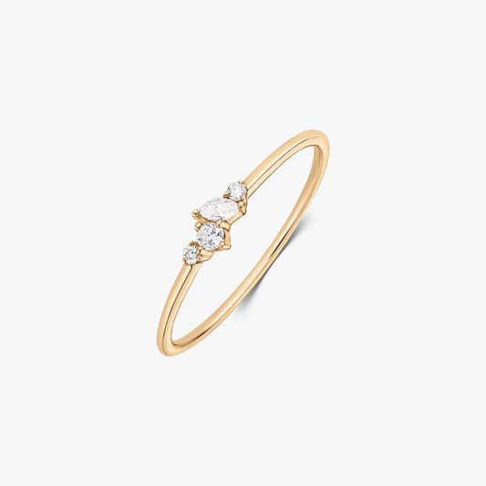 Nova 14K yellow gold ring with a delicate cluster of five white diamonds on a slim band, shown on a white background.