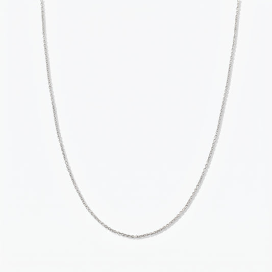 Simple sterling silver chain necklace photographed on a white background.
