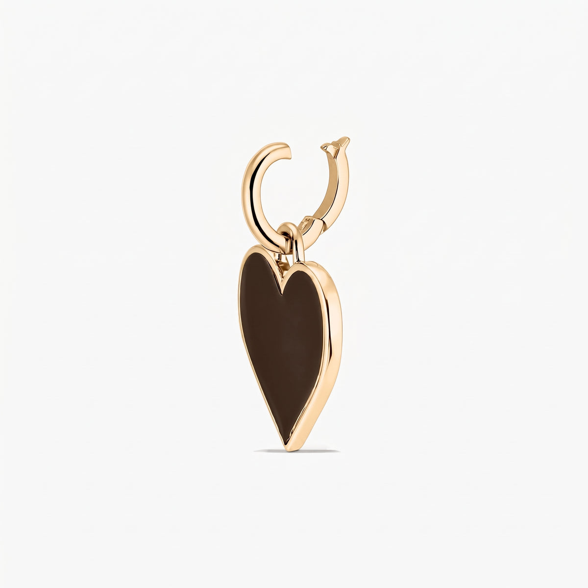 Heart-shaped brown pendant charm with a polished metal frame and hoop bail, isolated on a white background.