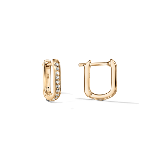 Pair of U-shaped huggie earrings in 925 silver with a gold finish; one hoop pavé-set with clear zirconia, shown front and side on a clean, transparent background.