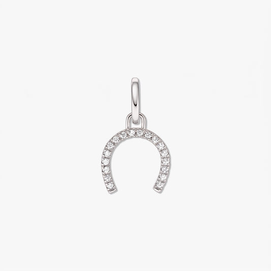Sterling silver horseshoe pendant with clear zirconia pavé, isolated on a white background.