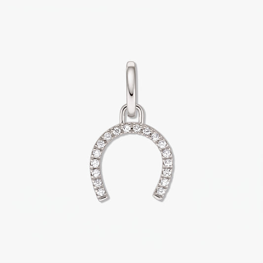 Sterling silver horseshoe pendant set with white zirconia stones on a white background.