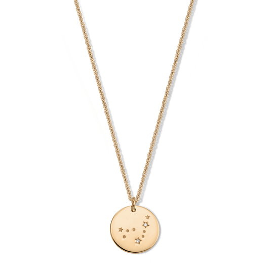 Gold‑tone 925 silver zodiac necklace with a round Capricorn constellation pendant set with small white sapphire accents, isolated on a transparent background.