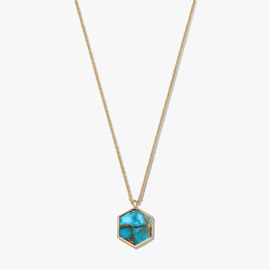 Gold-plated sterling silver necklace with a hexagonal turquoise blue copper pendant on a white background.