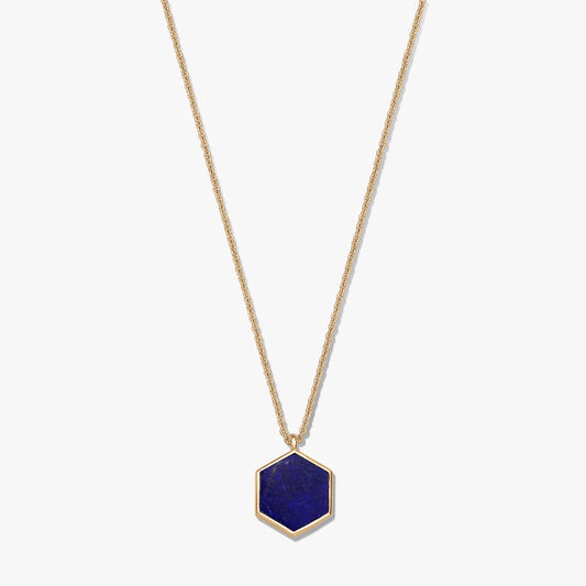 Gold-plated sterling silver necklace with a hexagon lapis lazuli pendant on a white background.