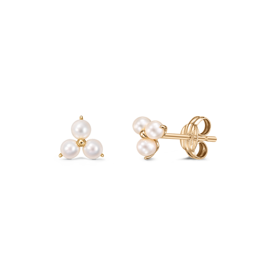 Indira Pointe gold stud earrings featuring a trio of white cultured pearls in a triangular cluster, shown front and side on a transparent background.