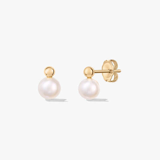 Pair of cultured pearl stud earrings with silver posts and butterfly backs on a white background.
