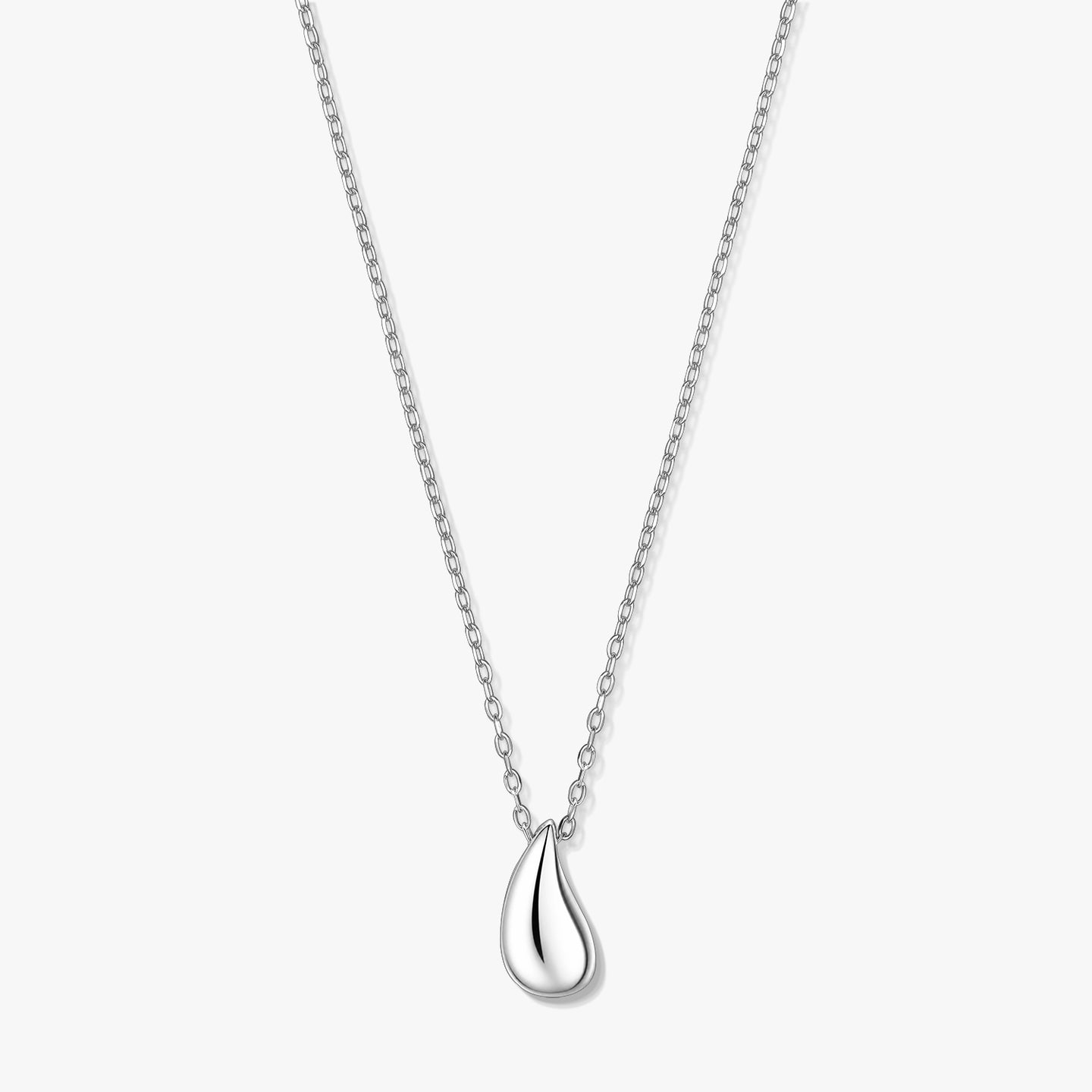 Silver teardrop pendant necklace on a fine chain, photographed on a white background.