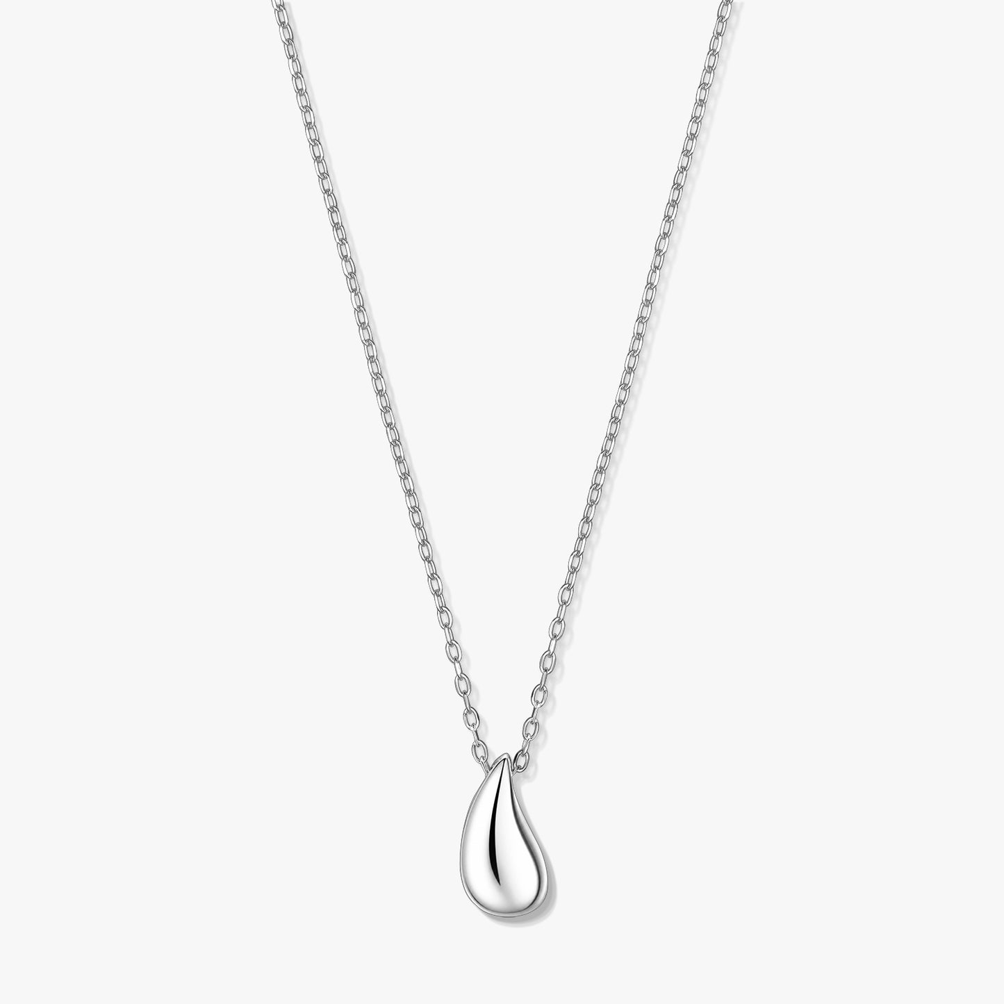 Silver teardrop pendant necklace on a fine chain, photographed on a white background.