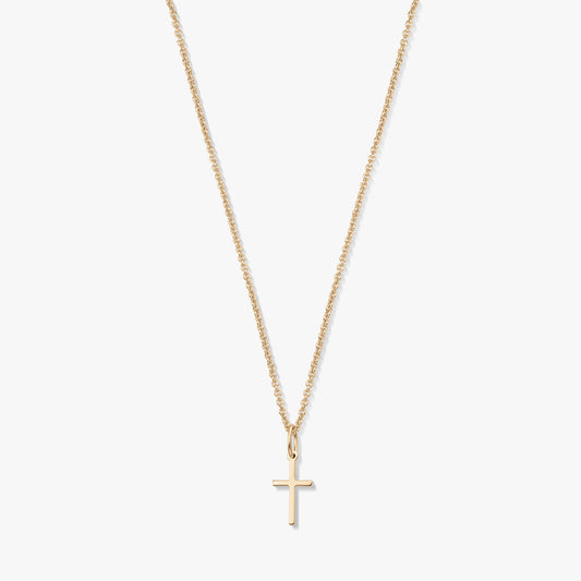 Minimalista 14K sárga arany nyaklánc apró kereszt medállal, finom láncon, fehér háttéren.