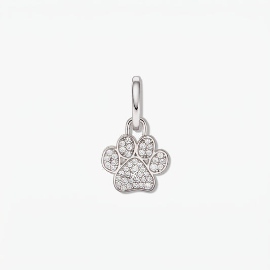 Sterling silver paw-print pendant set with white cubic zirconia on a polished bail, isolated on a white background.