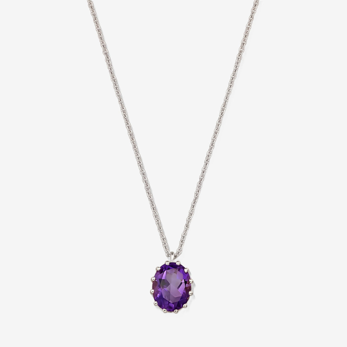 Sterling silver necklace with an oval faceted amethyst pendant on a white background.
